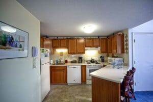 Eat-in Kitchen with oak cabinets helps simplify your wells maine vacation