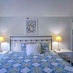 Bedroom with Blue bedspread - wells maine hotels