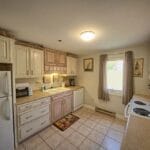 Kitchen with whitewash cabinets in our wells maine vacation rentals