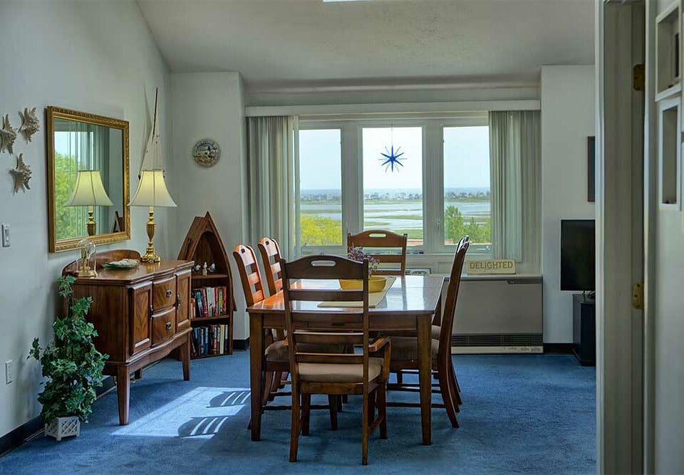Dining room overlooking marsh in our wells maine vacation rentals