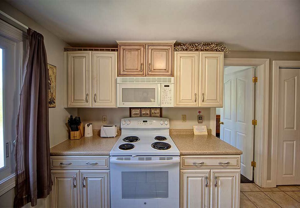 White cabinets in Kitchen in our wells maine vacation rental