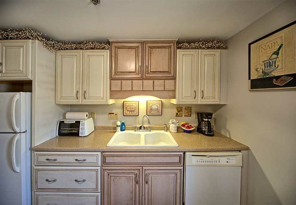 Small kitchen in our wells maine vacation rental - Village by the Sea