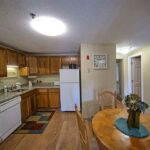 Kitchen with dining table in our Maine condo rentals
