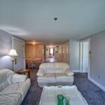 Bedroom with white leather couches - 2 bedroom suites in wells maine