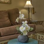 White flowers on glass coffee table in Wells Me vacation rental