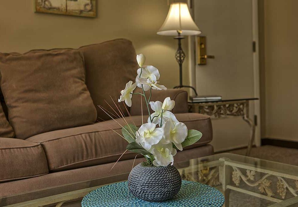 White flowers on glass coffee table in Wells Me vacation rental