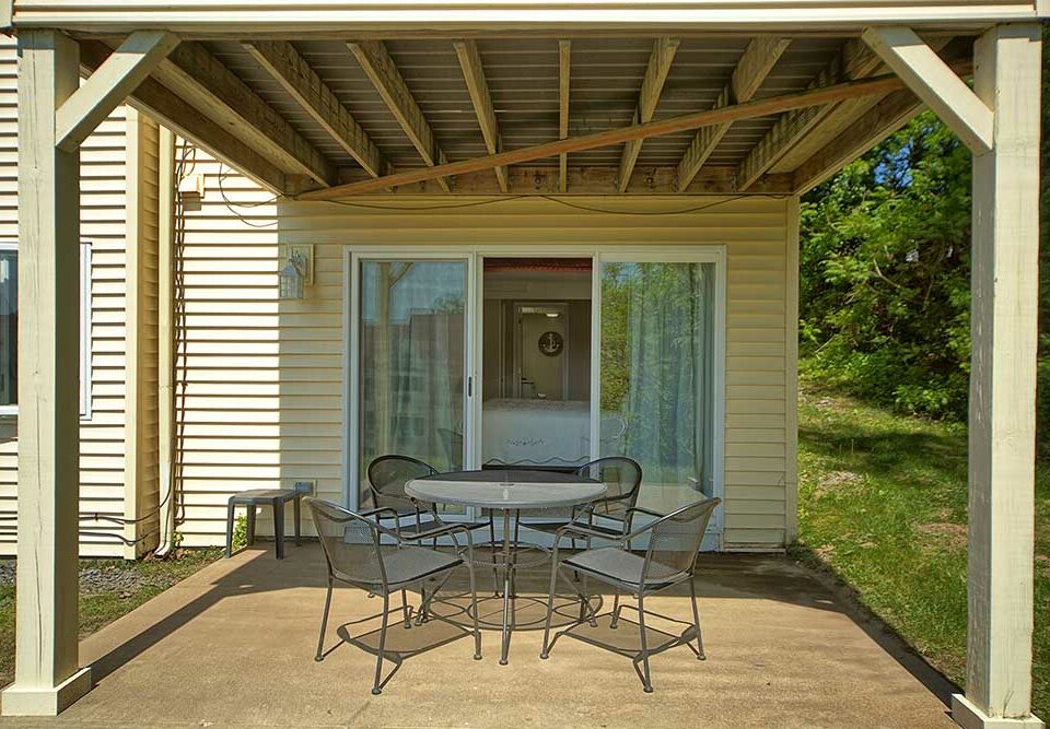 Patio with table and chairs at Maine vacation rental